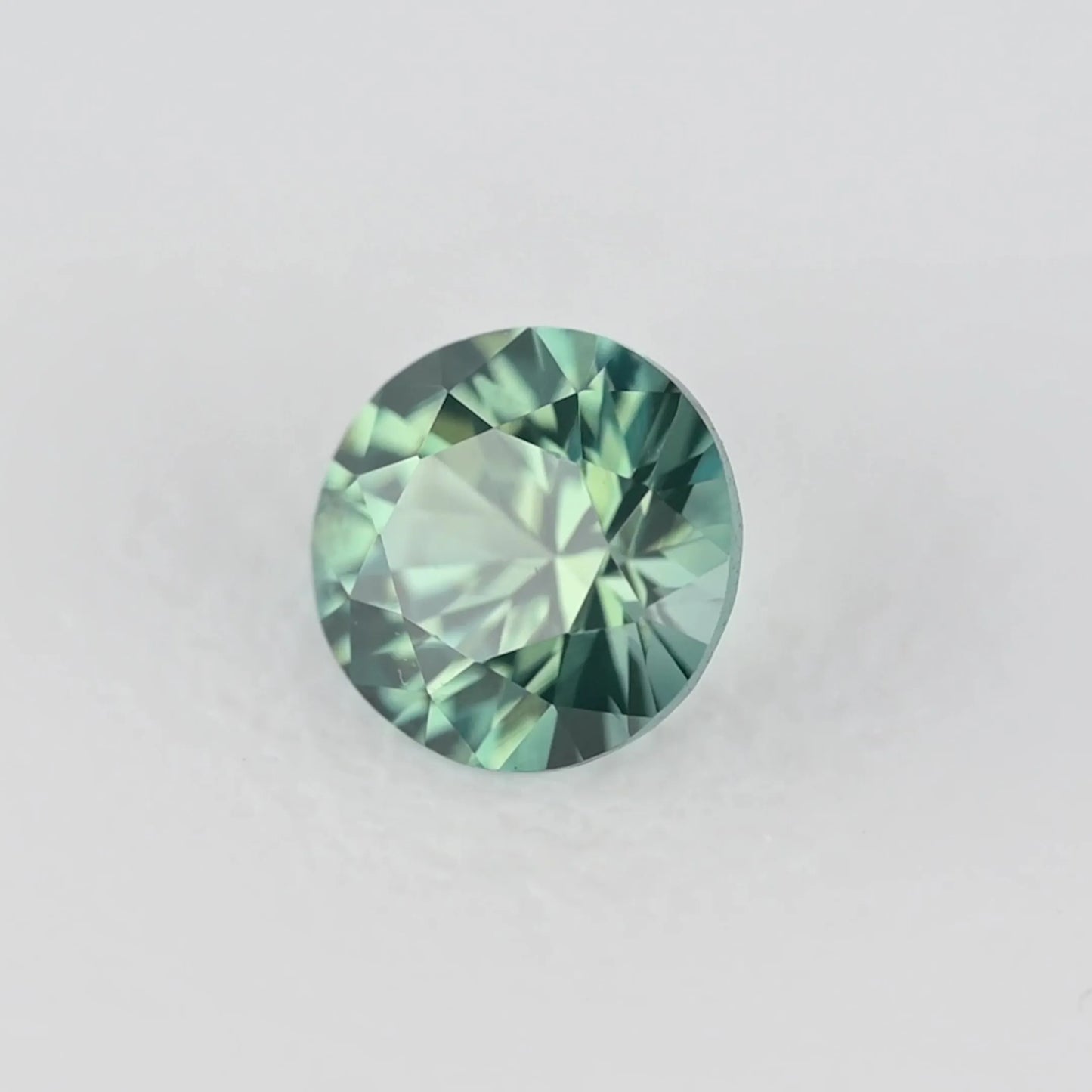 0.22ct Round Natural Sapphire (Colour Teal, Clarity Eye Clean, Cut Faceted)