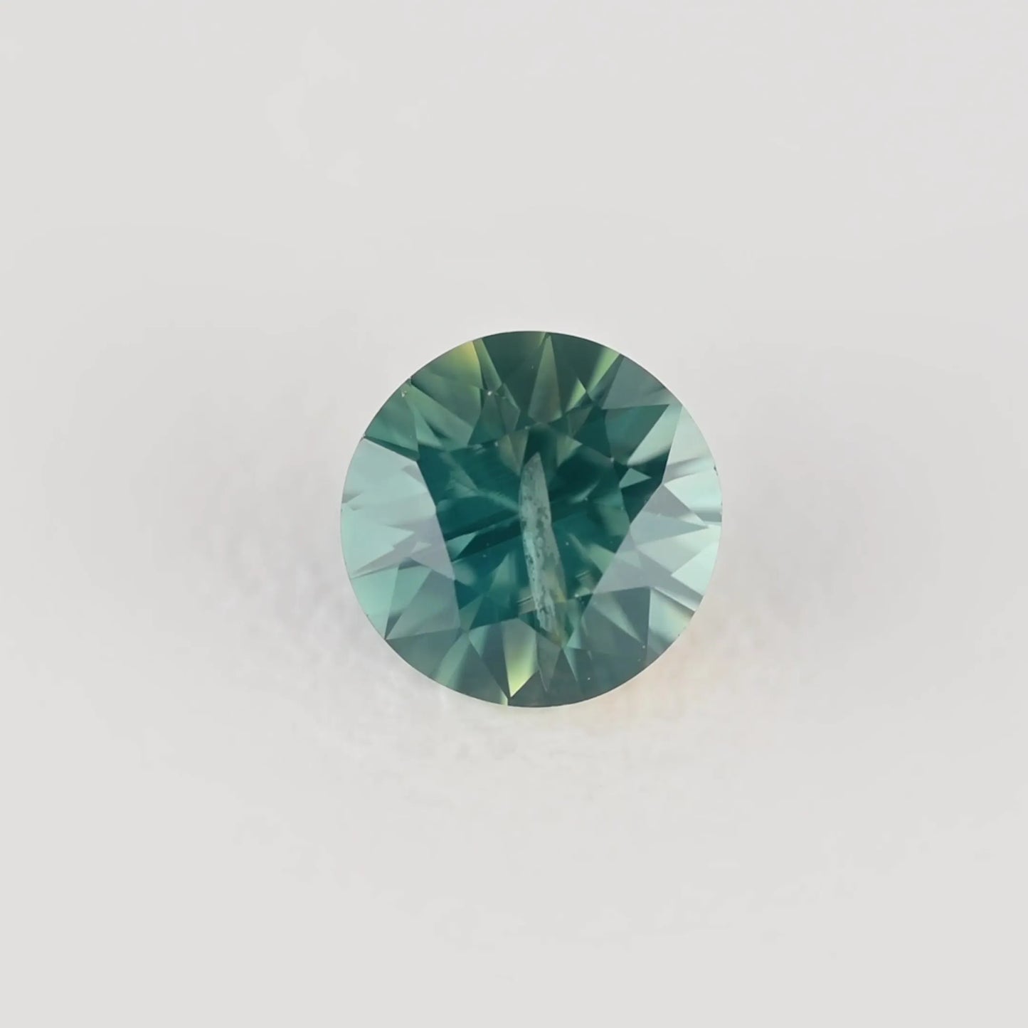 0.32ct Round Natural Sapphire (Colour Teal, Clarity Moderately Included, Cut Faceted)