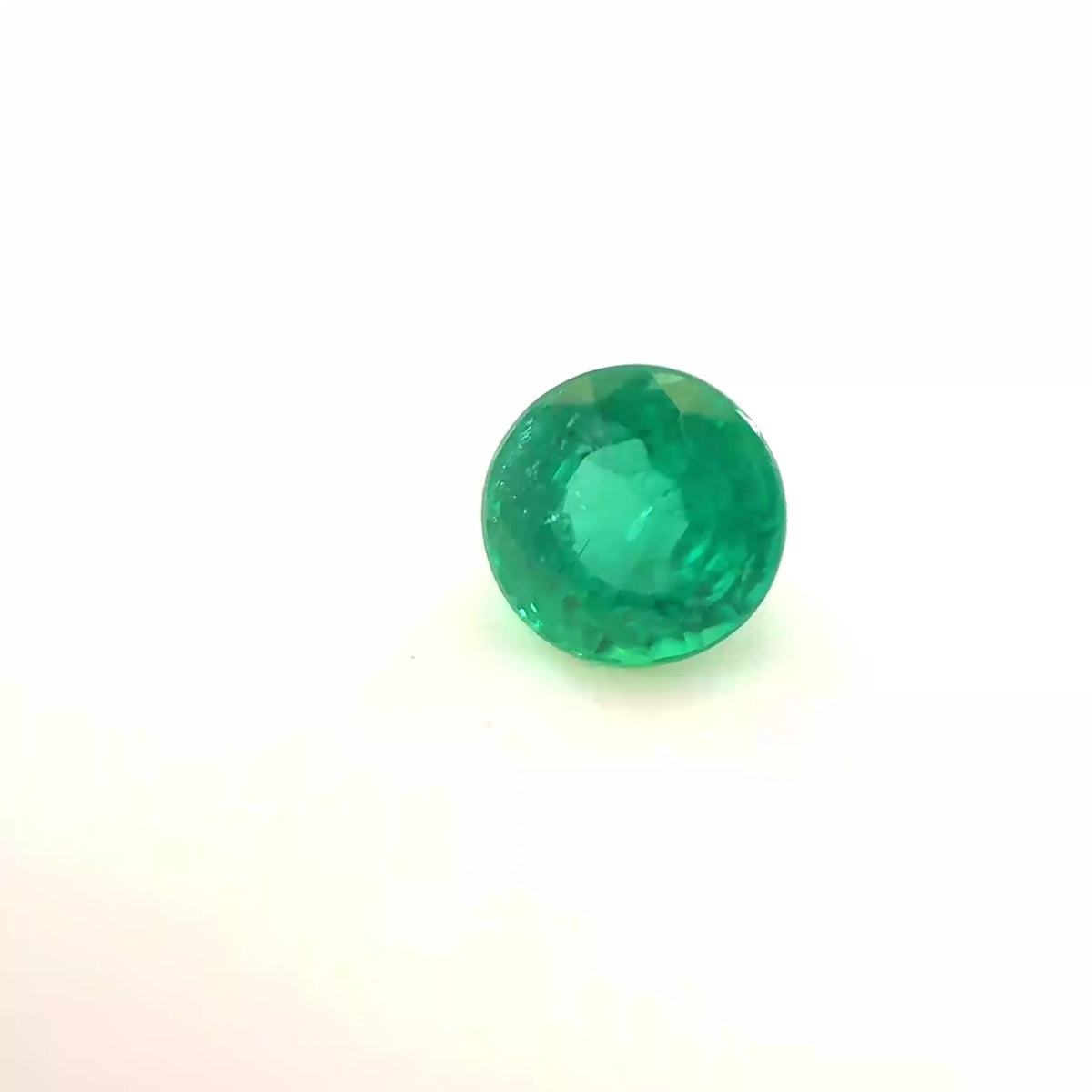 0.45ct Round Natural Emerald (Colour Green, Clarity Slightly Included, Cut Faceted)