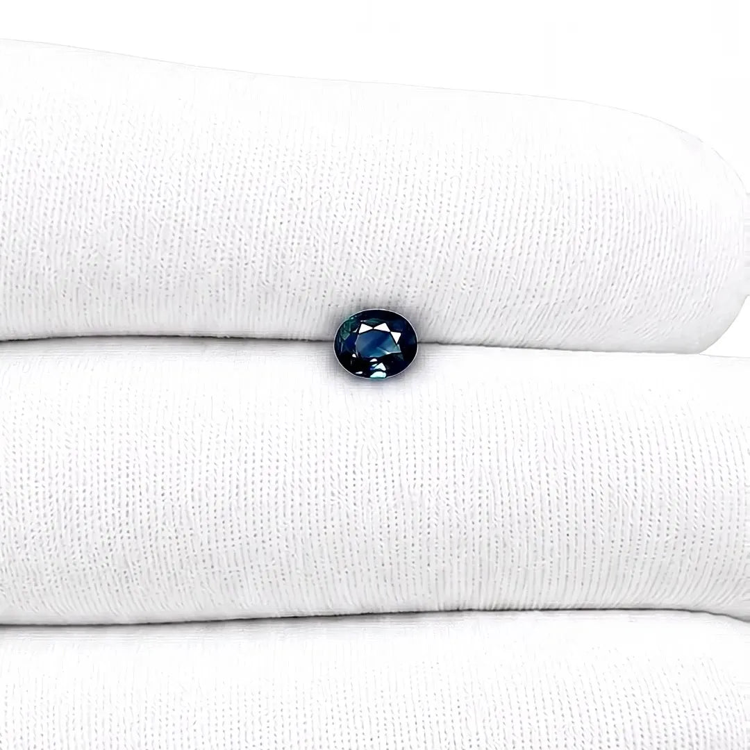 0.63ct Oval Natural Sapphire (Colour Teal, Clarity Slightly Included, Cut Faceted)