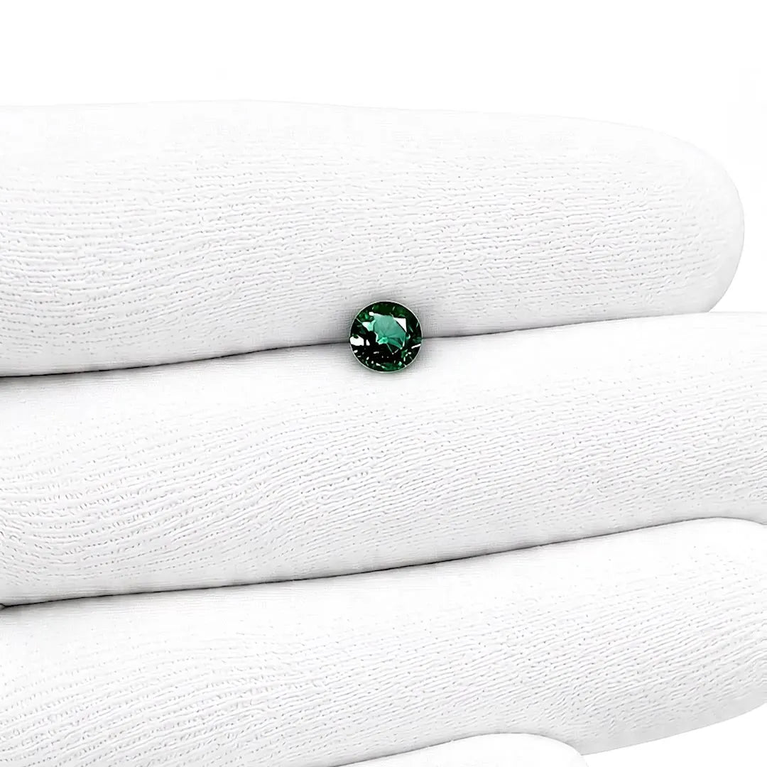 0.64ct Round Natural Sapphire (Colour Teal, Clarity Slightly Included, Cut Faceted)