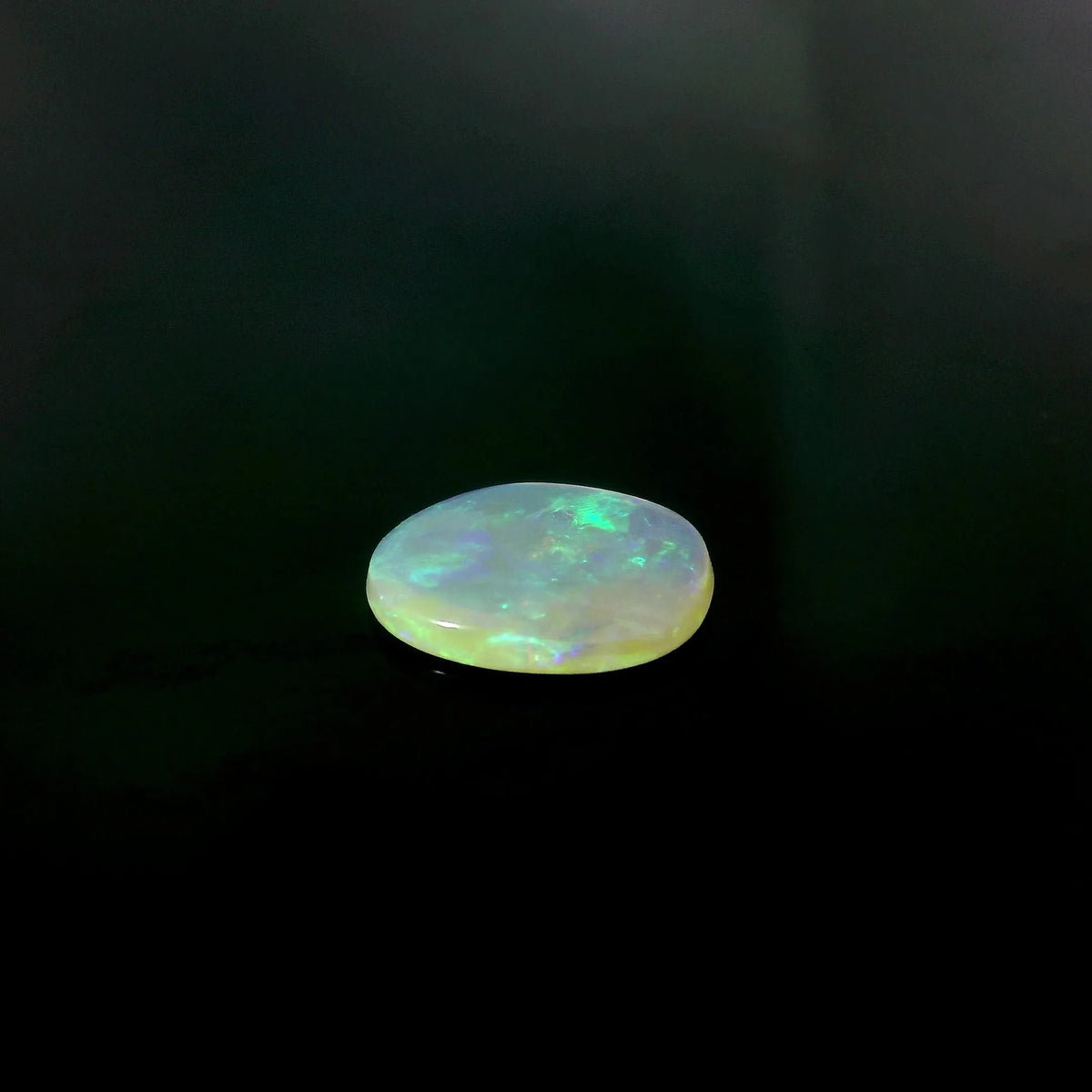0.79ct Oval Natural Opal (Colour White, Clarity Moderately Included, Cut Cabochon)